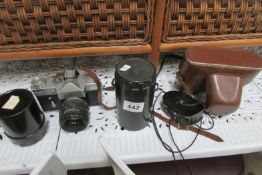 2 Camera's, 2 lenses and a light meter