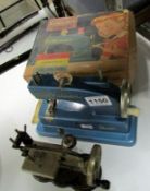 A Vulcan toy sewing machine and one other