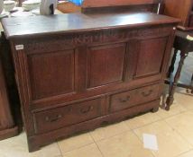 An 18th century oak chest with false drawers