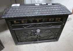 A wall mounting cast iron letter box
