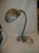 An adjustable art deco table lamp with scallop shade