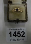 An 18ct gold ring set diamonds and sapphire