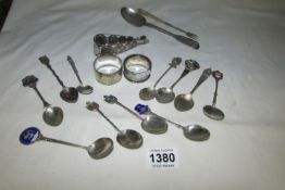 A quantity of souvenier spoons, napkin rings etc, some silver