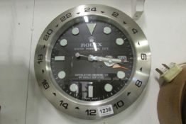 A Rolex dealers display wall clock