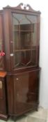 A mahogany astragal glazed corner cabinet