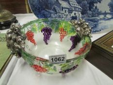 A grape decorated glass bowl