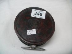 A Bakelite fishing reel