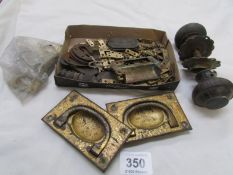 A box of brass hinges, drawer handles etc