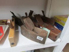 A quantity of old woodworking tools inc. planes
