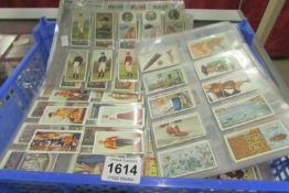 Approximately 140 sheets of mixed cigarette cards