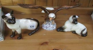 A Beswick bald eagle and 2 cats, (eagle & 1 cat are seconds with chips under glaze, other cat is a/