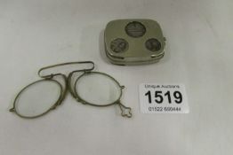 A coin case and pince nez