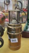 A brass Davy lamp