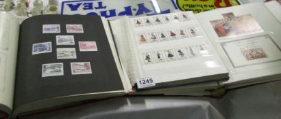 4 albums of mainly foreign stamps