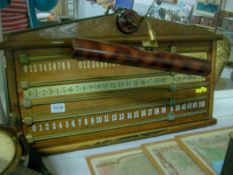 An oak snooker score board with light