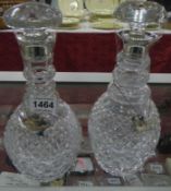 A pair of superb quality decanters with silver collars and silver labels, HM London