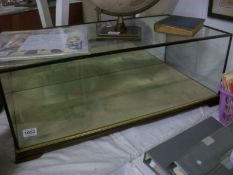 A table top glass display cabinet