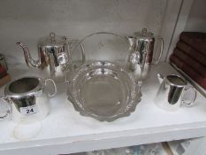 A silver plate tea set and basket