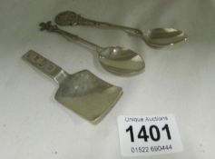 A silver caddy spoon and 2 silver collector's spoons
