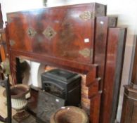 A 1930's fire surround with cupboards and brass fittings