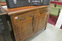 A mahogany cross banded 2 drawer, 2 cupboard sideboard