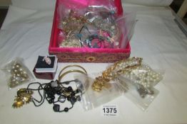 A box of costume jewellery inc chains, bangles etc