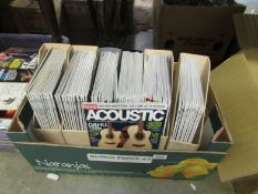 A box of guitar magazines