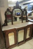 A Victorian mahogany inlaid marble to chiffioniere with arched top mirror back