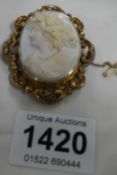 A cameo brooch in yellow metal mount