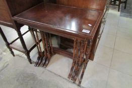 A nest of 4 mahogany tables