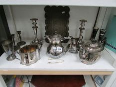 A mixed lot of silver plate, candlesticks, teapots etc