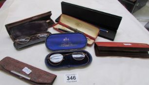 A quantity of pens and 2 pairs of vintage spectacles