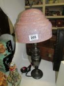 A metal table lamp with 1930's glass shade