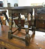 A small circular oak table