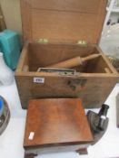 A wooden box and contents including flat iron