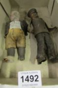A tin plate soldier and an old doll (a/f)