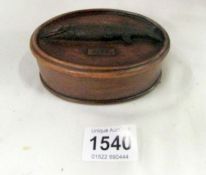 A lidded box with pike on lid