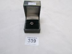 A 9ct gold ring set jet and diamonds