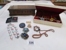 A box of costume jewellery and a wooden jewellery box