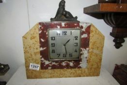 A French marble clock surmounted with spelter birds