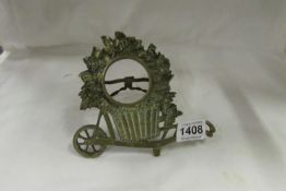 A Victorian brass 'Harvest wheelbarrow' pocket watch stand