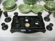 A quantity of ebony candlesticks, tray etc