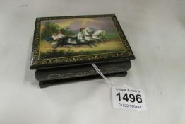 A lacquered box with horse scene on lid