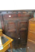 A Georgian oak corner cupboard