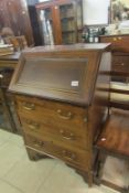 A mahogany inlaid bureau