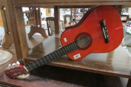 A Burswood small accoustic guitar