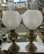 2 brass oil lamps with shades