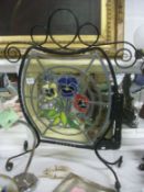 A leaded and stained glass fire screen