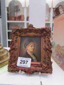 A framed hand painted miniature on wood