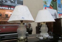 A pair of glass table lamps with shades